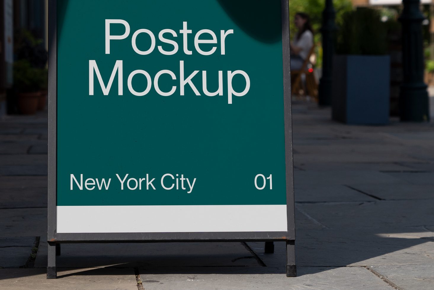 Outdoor poster mockup displayed on city sidewalk with clear text for branding, realistic urban setting for graphic design presentations.